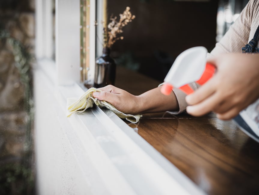 Cleaner Spraying and Wiping Window Sill